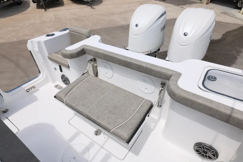 Slide: The Image of 2026 Sea Hunt Gamefish 27 Coffin Box boat interior with seating and dual engines. - 4