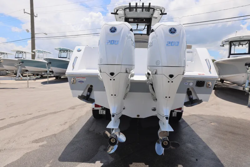 Slide: The Image of 2026 Sea Hunt Gamefish 27 Coffin Box with dual Yamaha 200 engines, rear view. - 6