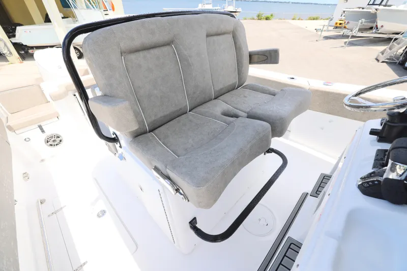 Slide: The Image of 2026 Sea Hunt Gamefish 27 Coffin Box boat seating, featuring comfortable gray upholstery. - 8