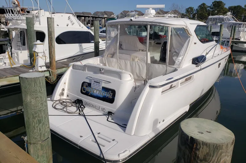 Slide: The Image of 2007 Tiara Yachts 4300 Sovran docked at marina, rear view. - 2