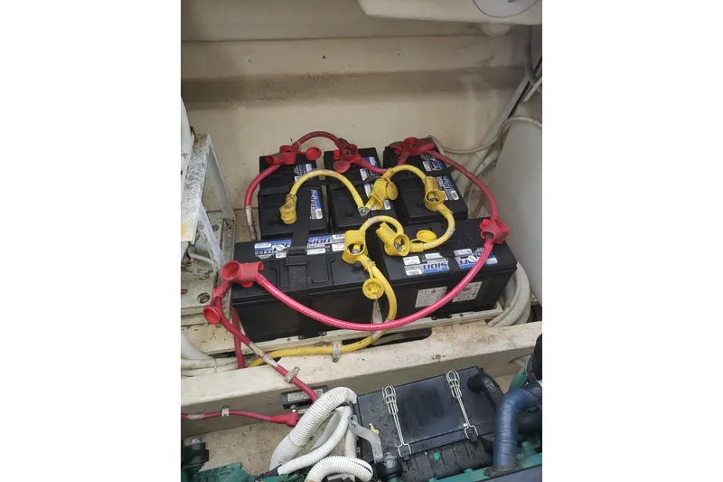 Slide: The Image of Battery compartment of a 2007 Tiara Yachts 4300 Sovran with connected cables. - 33