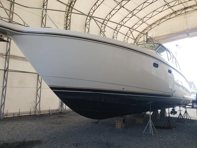 Slide: The Image of 2007 Tiara Yachts 4300 Sovran in storage, side view under a canopy. - 5