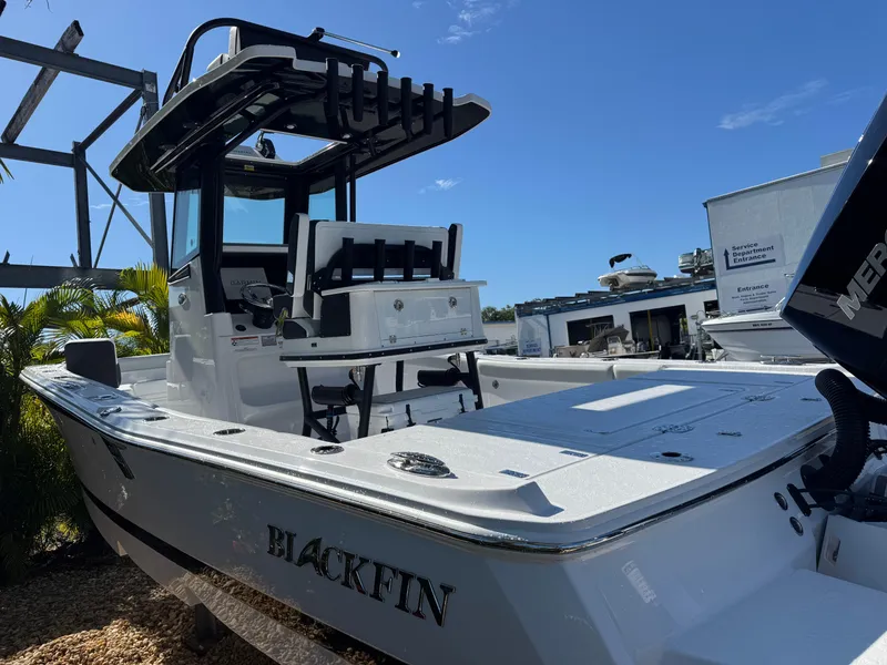 Slide: The Image of 2026 Blackfin 262 HB boat displayed outdoors under clear blue sky. - 10