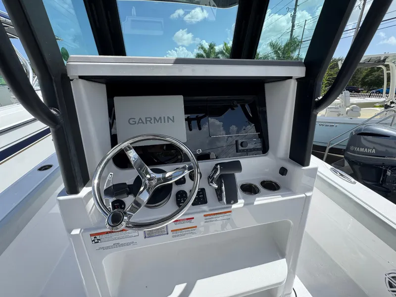 Slide: The Image of 2026 Blackfin 262 HB boat console with Garmin navigation and steering wheel. - 22