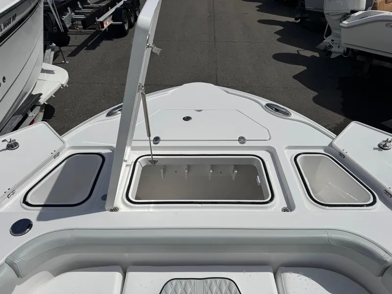 Slide: The Image of 2026 Blackfin 262 HB boat deck with open storage compartments. - 29