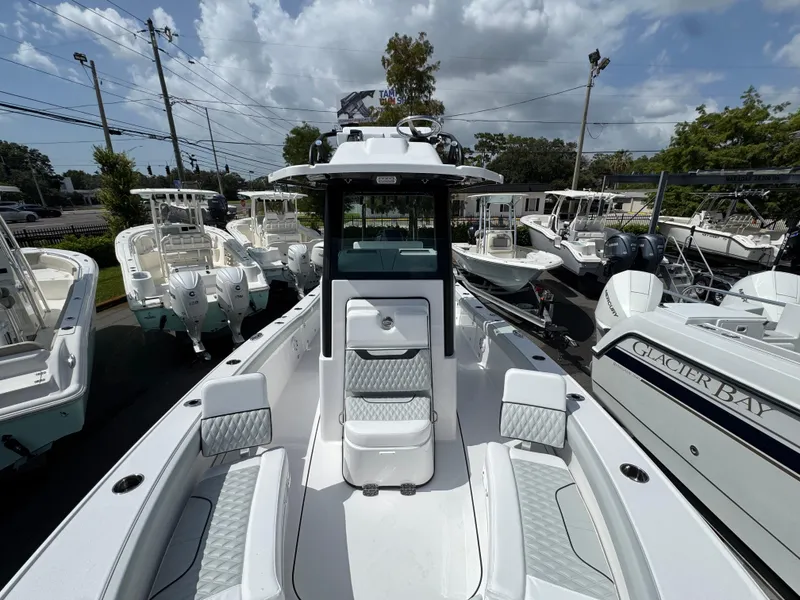 Slide: The Image of 2026 Blackfin 262 HB boat displayed among other boats under a cloudy sky. - 31