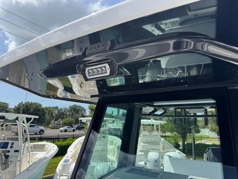 Slide: The Image of 2026 Blackfin 262 HB boat with modern lighting and sleek design. - 34