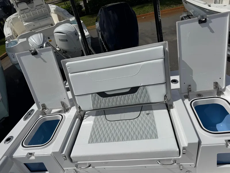 Slide: The Image of 2026 Blackfin 262 HB boat with open storage compartments and seating area. - 38
