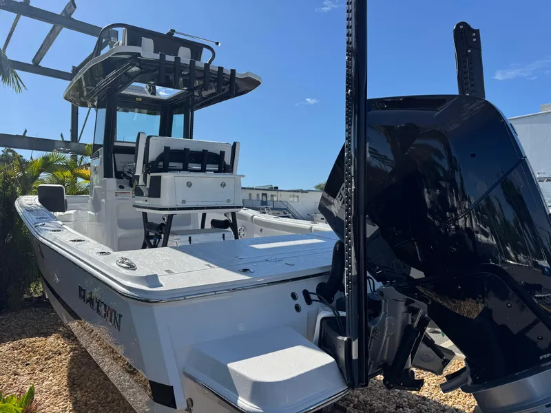 Slide: The Image of 2026 Blackfin 262 HB boat with sleek design and powerful engine, docked outdoors. - 9