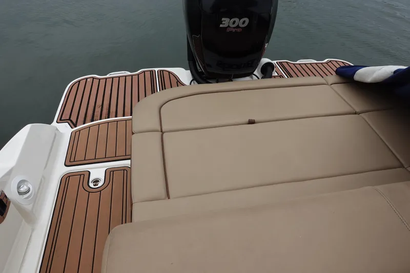 Slide: The Image of 2015 Sea Ray 270 Sundeck Outboard with tan seating and wood deck, featuring a 300 Pro engine. - 10