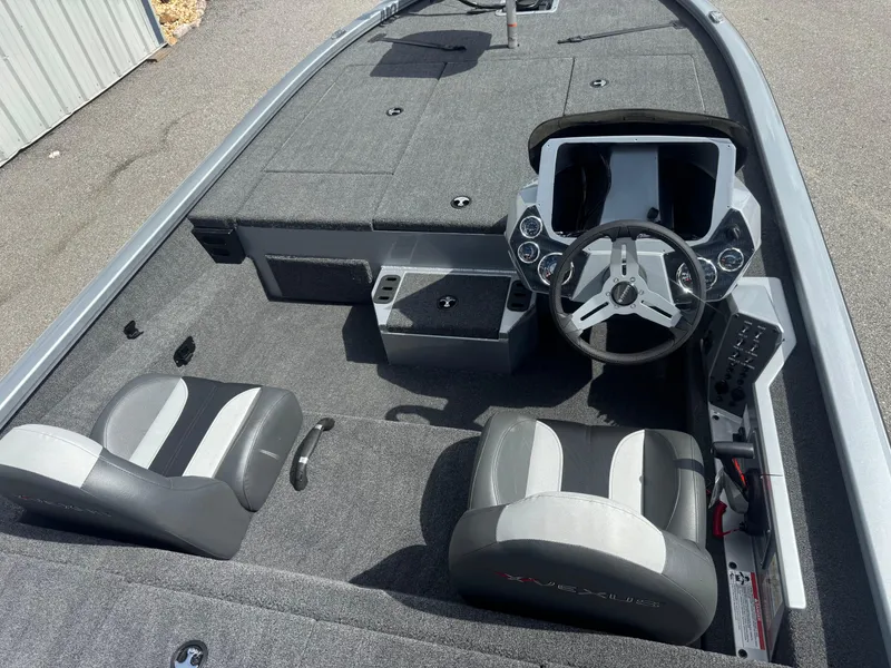 Slide: The Image of 2026 Vexus AVX1880 boat interior with dual seats and steering console. - 12