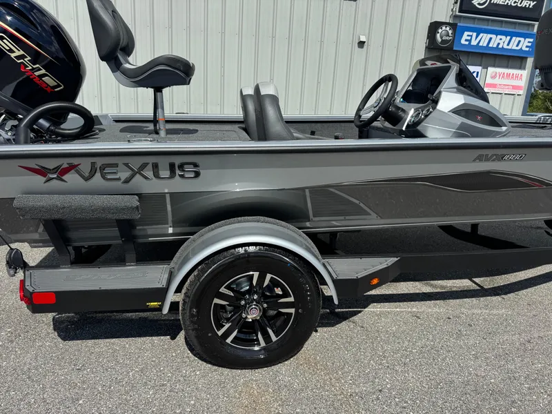 Slide: The Image of 2026 Vexus AVX1880 boat with sleek design, gray exterior, and modern dashboard. - 14