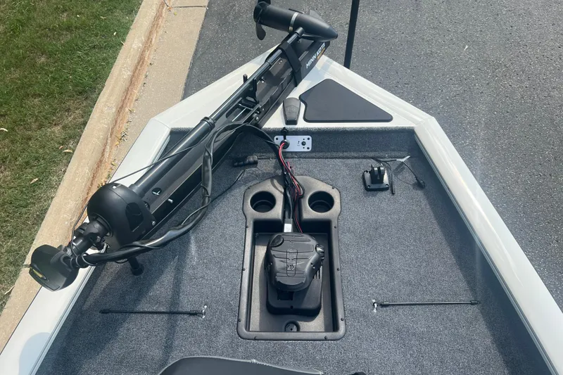 Slide: The Image of 2025 Tracker Pro Team 190 boat deck with trolling motor and control panel. - 4