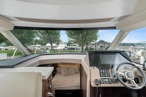 Slide: The Image of Open fridge on 2017 Regal 42 Grande Coupe yacht, stocked with beverages. - 13