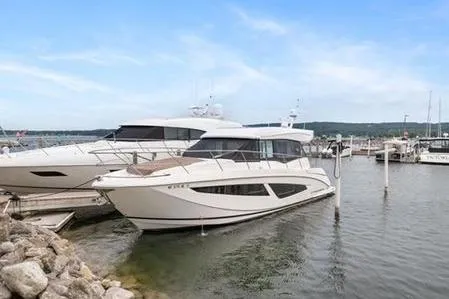 Slide: The Image of Luxurious interior of 2017 Regal 42 Grande Coupe yacht with modern amenities and seating. - 2