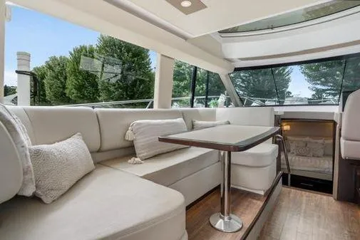 Slide: The Image of 2017 Regal 42 Grande Coupe docked at marina, rear view. - 8