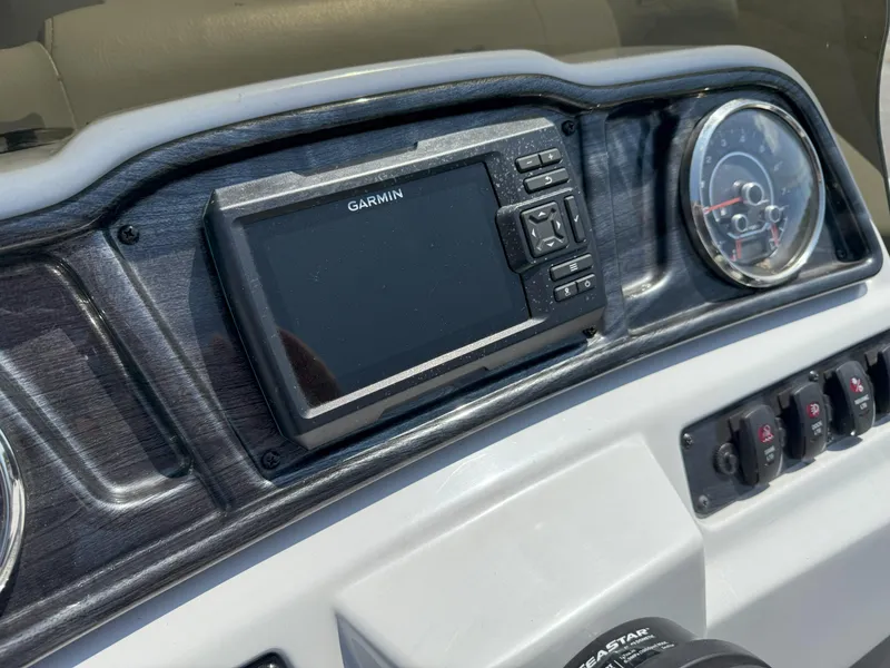 Slide: The Image of Dashboard of 2022 Godfrey Sweetwater 2186 C with Garmin display and controls. - 11