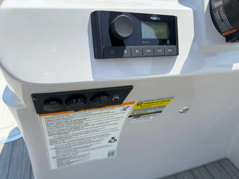 Slide: The Image of Control panel of 2022 Godfrey Sweetwater 2186 C boat with Fusion audio system. - 12
