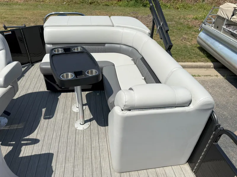 Slide: The Image of 2022 Godfrey Sweetwater 2186 C pontoon boat interior with gray seating and table. - 13