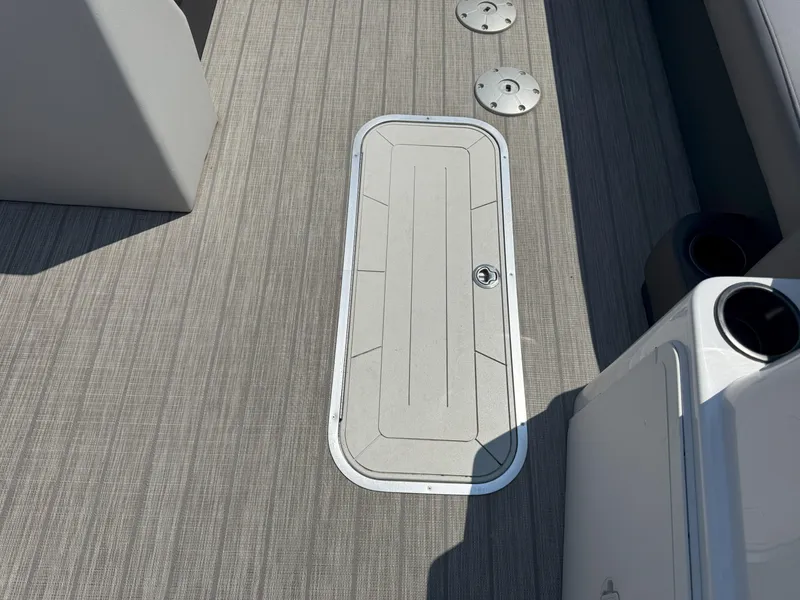 Slide: The Image of 2022 Godfrey Sweetwater 2186 C boat deck with storage hatch and cup holders. - 15