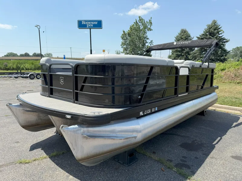 Slide: The Image of 2022 Godfrey Sweetwater 2186 C pontoon boat parked near Rodeway Inn. - 3