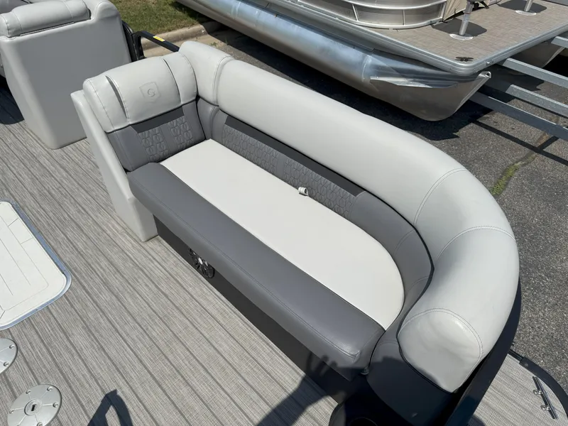 Slide: The Image of Luxurious seating on 2022 Godfrey Sweetwater 2186 C pontoon boat, featuring gray and white upholstery. - 7