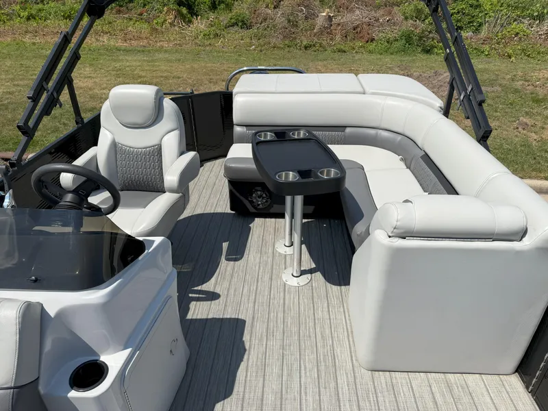 Slide: The Image of 2022 Godfrey Sweetwater 2186 C pontoon boat interior with seating and table. - 9