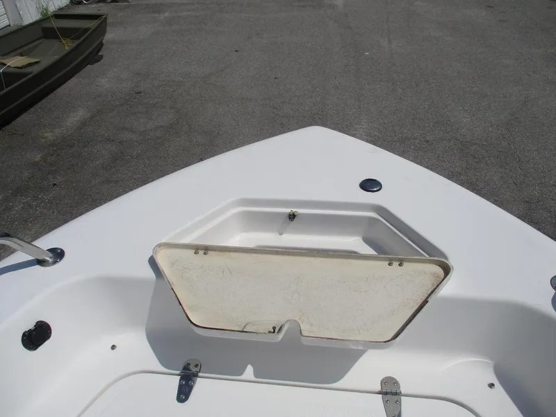 Slide: The Image of 2004 Sea Pro 180 Center Console boat deck with open storage compartment. - 11