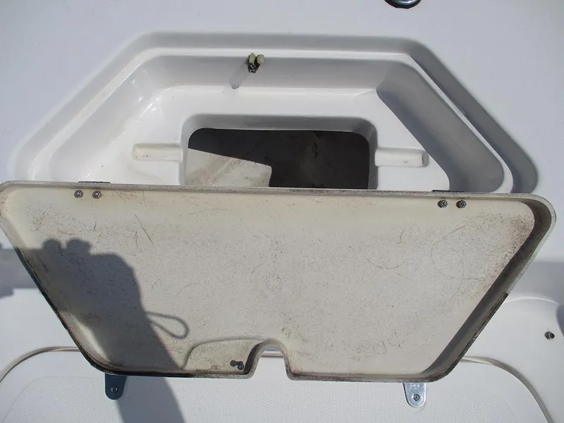 Slide: The Image of Open storage compartment on a 2004 Sea Pro 180 Center Console boat. - 12