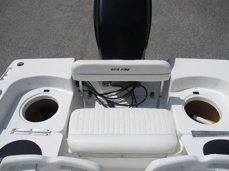 Slide: The Image of 2004 Sea Pro 180 Center Console boat interior with seating and storage compartments. - 17