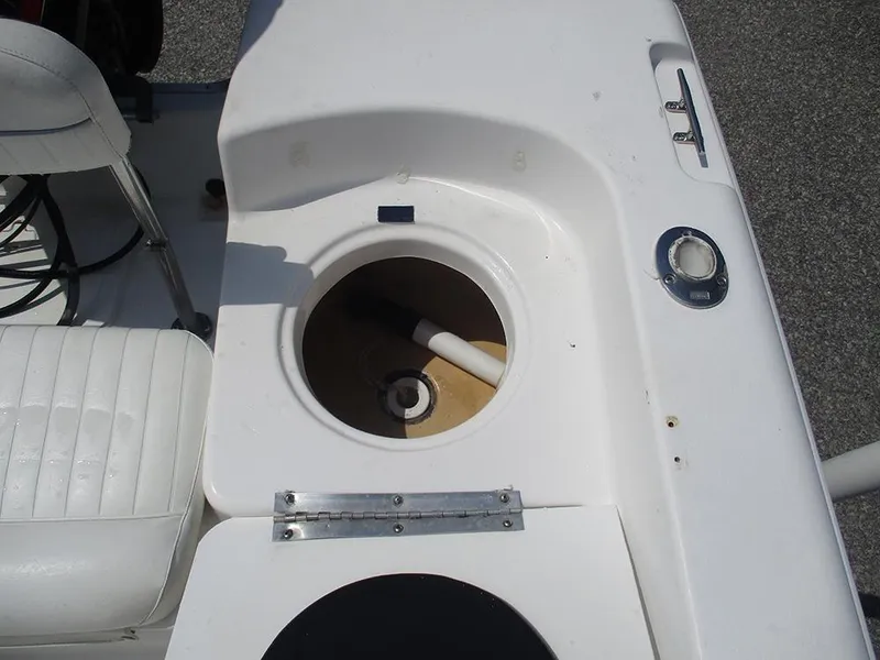 Slide: The Image of 2004 Sea Pro 180 Center Console boat interior with open storage compartment. - 18