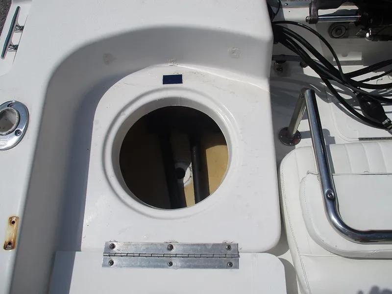 Slide: The Image of 2004 Sea Pro 180 Center Console boat interior with open storage compartment. - 19