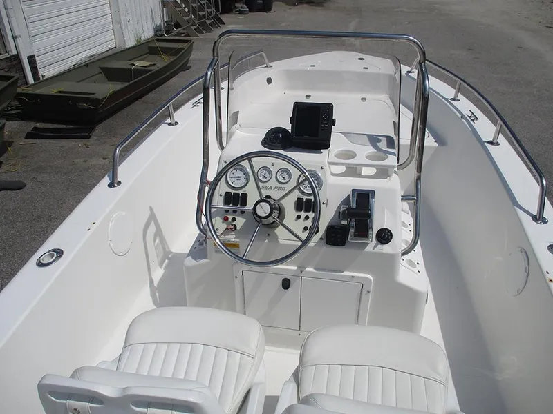 Slide: The Image of 2004 Sea Pro 180 Center Console boat interior with steering wheel and controls. - 20