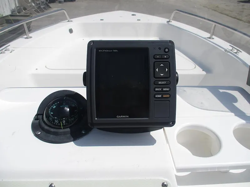 Slide: The Image of 2004 Sea Pro 180 Center Console with Garmin echomap 50s and compass on dashboard. - 21