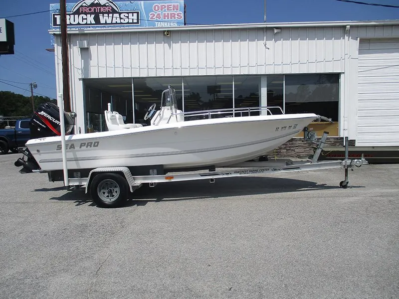 Slide: The Image of 2004 Sea Pro 180 Center Console boat on trailer outside truck wash. - 6