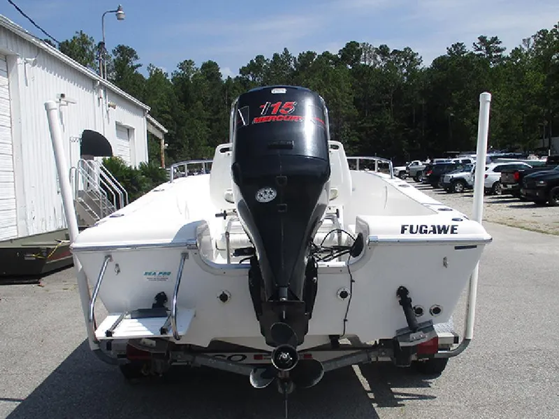 Slide: The Image of 2004 Sea Pro 180 Center Console boat with Mercury 115 outboard motor, parked outdoors. - 8