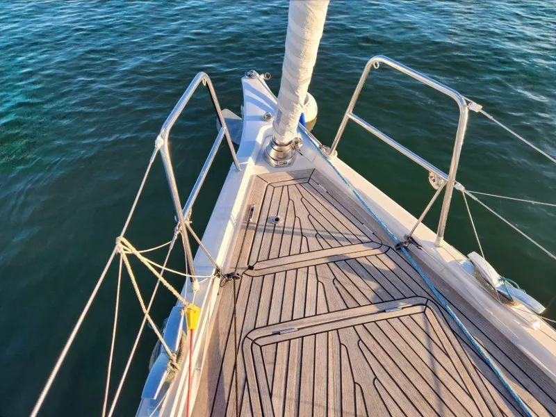 Slide: The Image of Bow of 2018 X-Yachts X4.9 sailboat with teak deck on calm water. - 10
