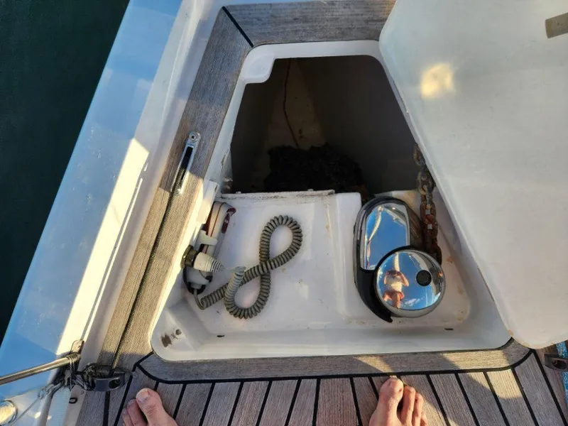 Slide: The Image of Open hatch on 2018 X-Yachts X4.9 sailboat deck, showing storage compartment. - 11
