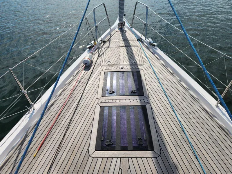 Slide: The Image of Deck of 2018 X-Yachts X4.9 sailboat with sleek wooden finish and blue ropes. - 13