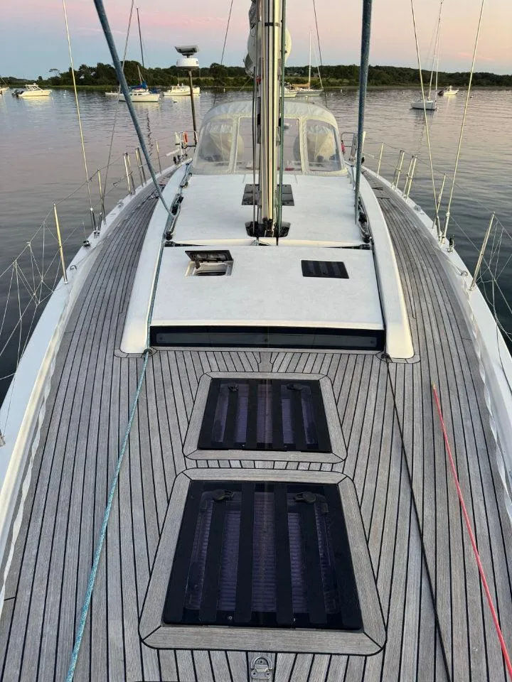 Slide: The Image of 2018 X-Yachts X4.9 sailboat deck with sleek design and scenic water view. - 14