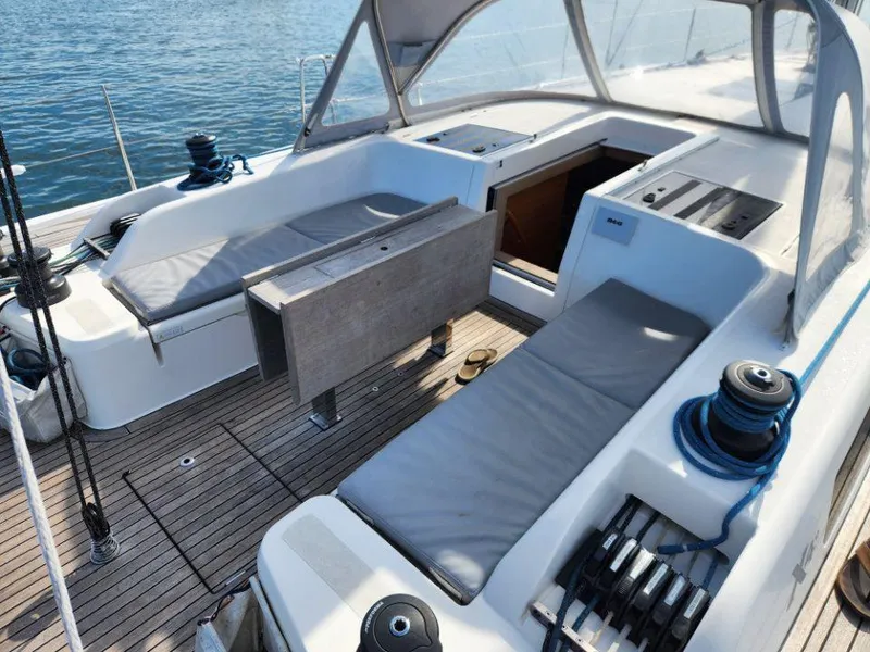 Slide: The Image of 2018 X-Yachts X4.9 sailboat cockpit with seating, winches, and teak decking. - 25
