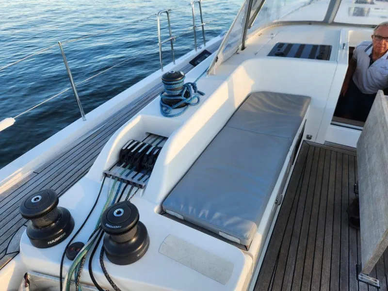 Slide: The Image of 2018 X-Yachts X4.9 sailboat deck with winches and seating area. - 26