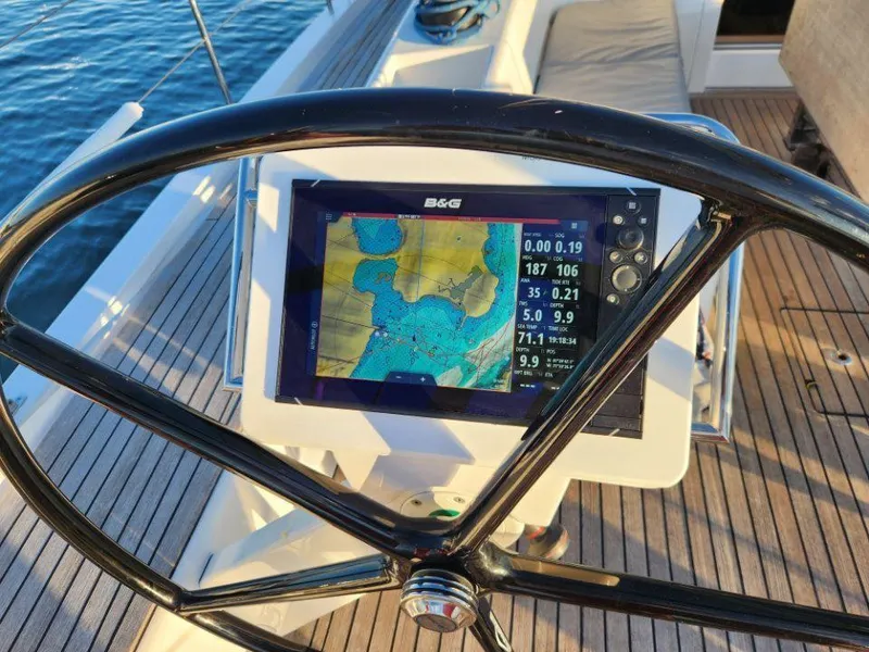 Slide: The Image of Steering wheel and navigation display on 2018 X-Yachts X4.9 sailboat. - 28