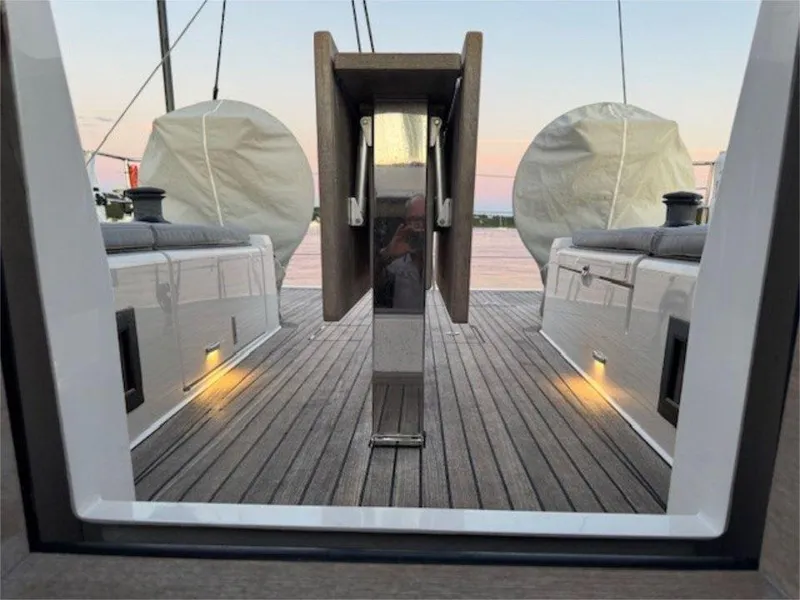 Slide: The Image of 2018 X-Yachts X4.9 yacht deck with sunset view, featuring sleek design and ambient lighting. - 30