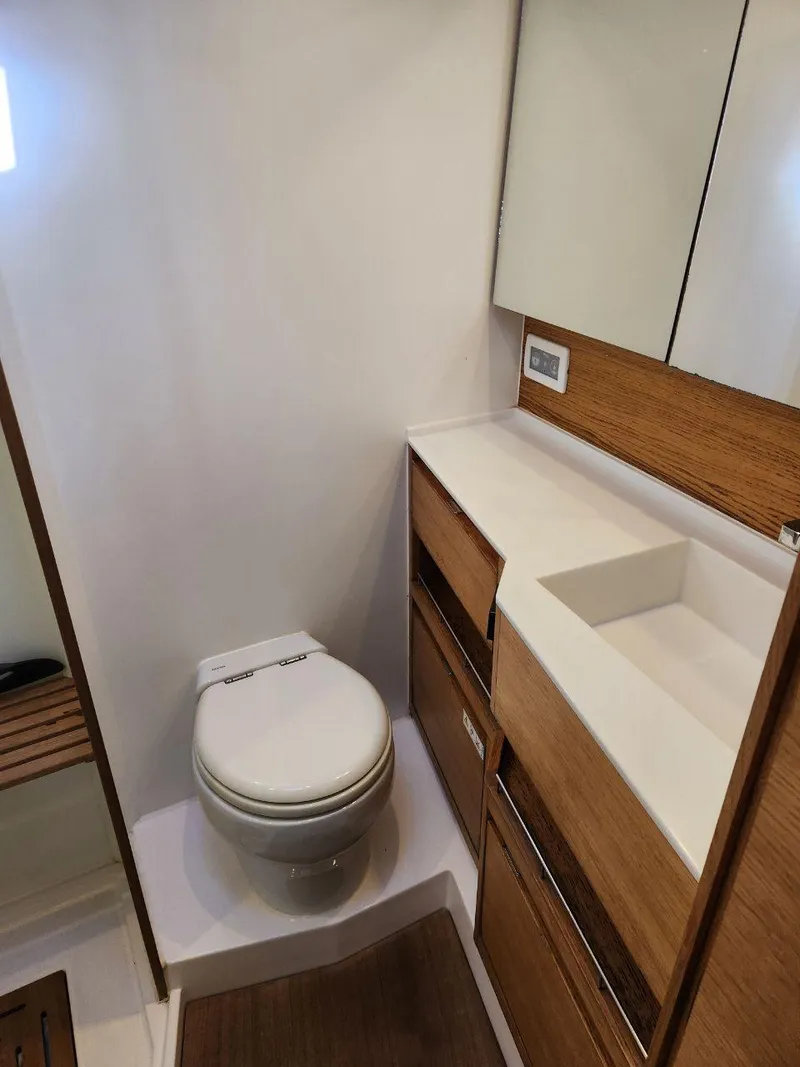 Slide: The Image of Modern bathroom in 2018 X-Yachts X4.9, featuring sleek design and wooden cabinetry. - 36