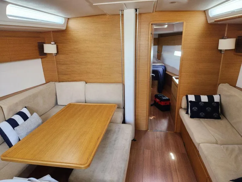 Slide: The Image of Interior of 2018 X-Yachts X4.9 sailboat with cozy seating and wooden finishes. - 38