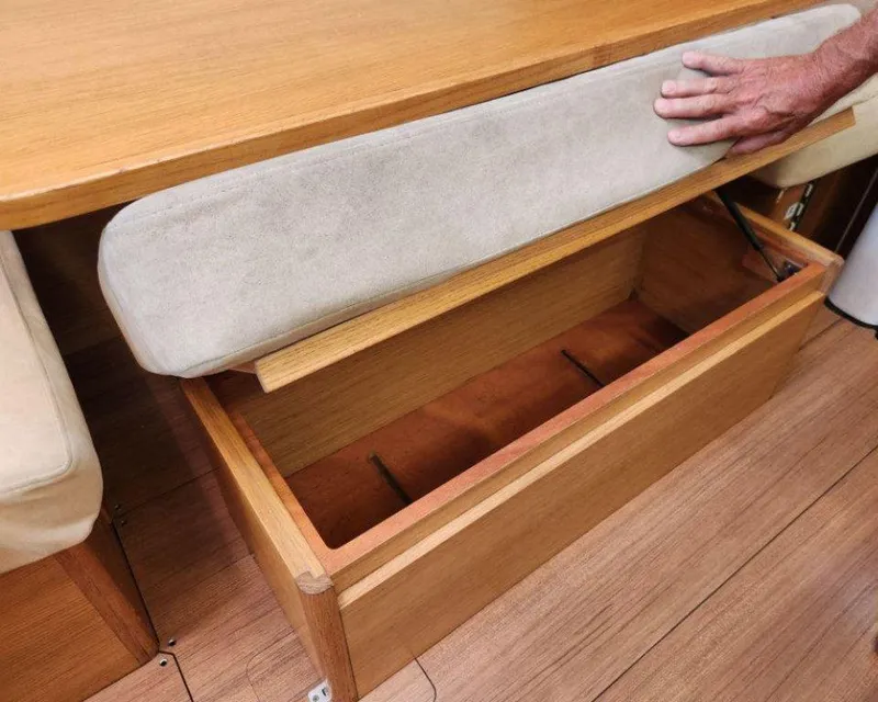 Slide: The Image of Interior storage compartment in 2018 X-Yachts X4.9, featuring wooden finish and cushioned seating. - 45