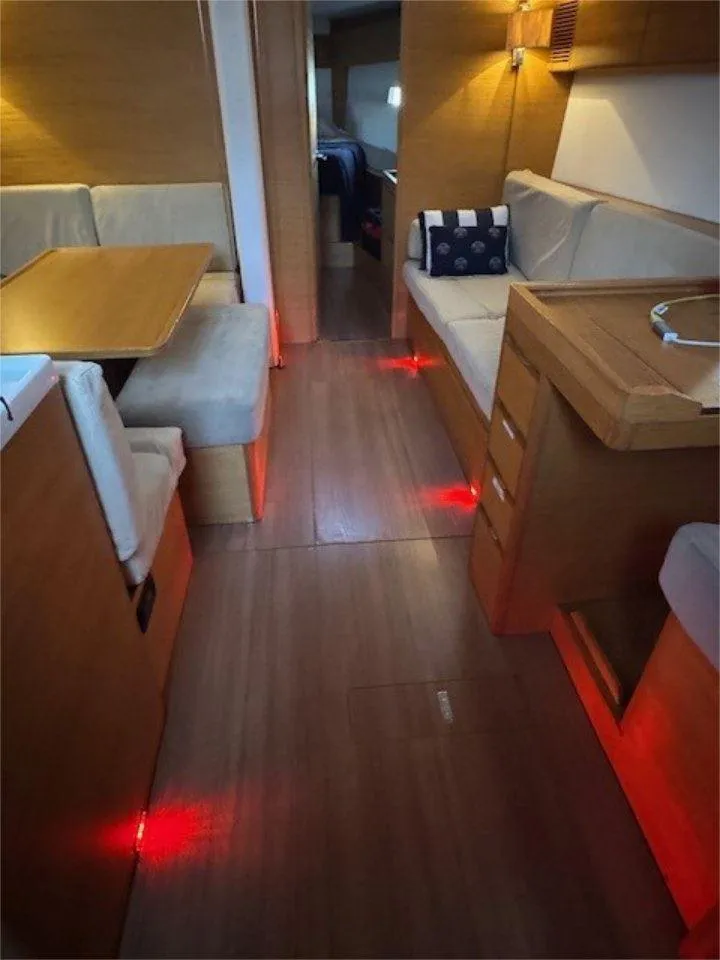 Slide: The Image of Interior of 2018 X-Yachts X4.9, featuring cozy seating and ambient lighting. - 47