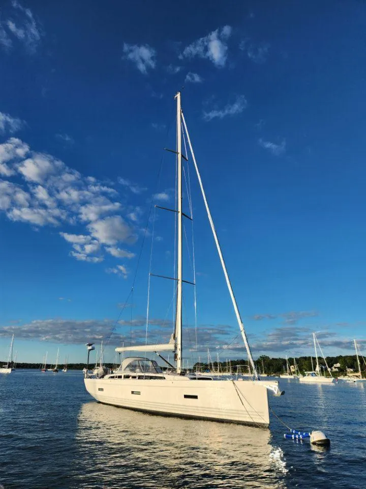 Slide: The Image of 2018 X-Yachts X4.9 sailboat on calm water under a clear blue sky. - 6