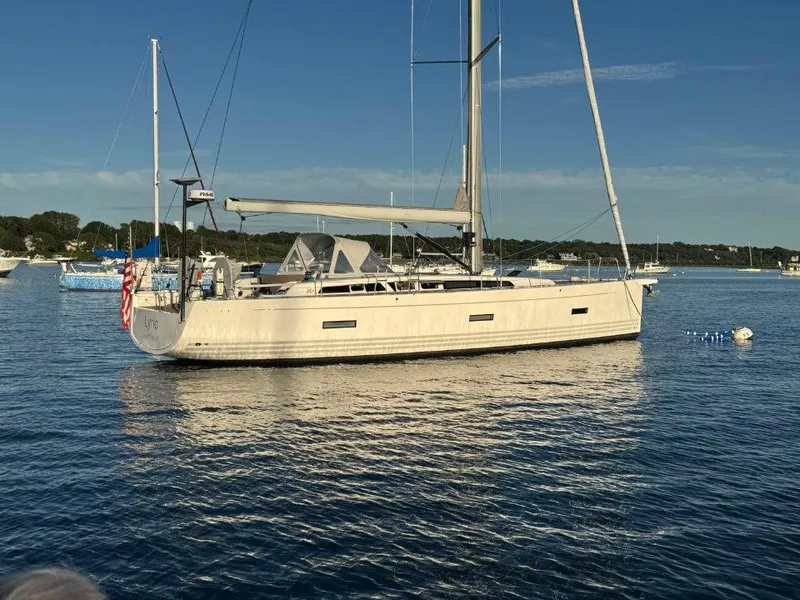 Slide: The Image of 2018 X-Yachts X4.9 sailboat anchored on calm water, clear sky background. - 7